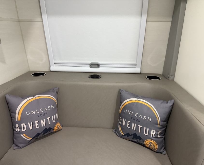 Tiger Panthera dinette seating with Unleash Your Adventure pillows and cup holders