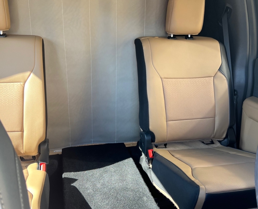 Tiger Panthera truck cab interior with tan leather seats and partition wall