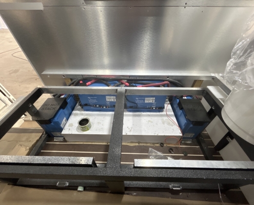 Tiger RV lithium battery compartment with blue batteries and metal frame