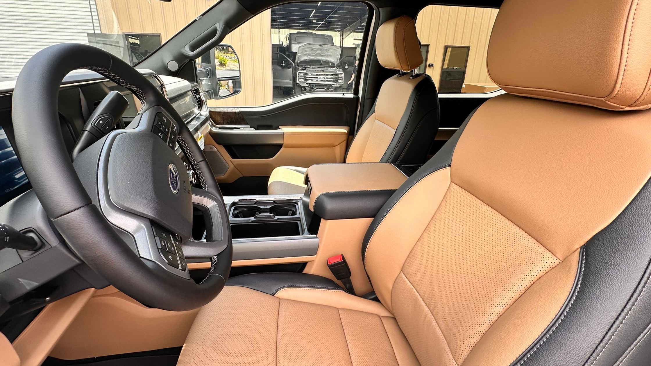 Ford Truck Cab Interior - Tan Leather Seats | Tiger Adventure Vehicles | Tiger Adventure Vehicles Ford truck cab interior with tan leather seats and center console